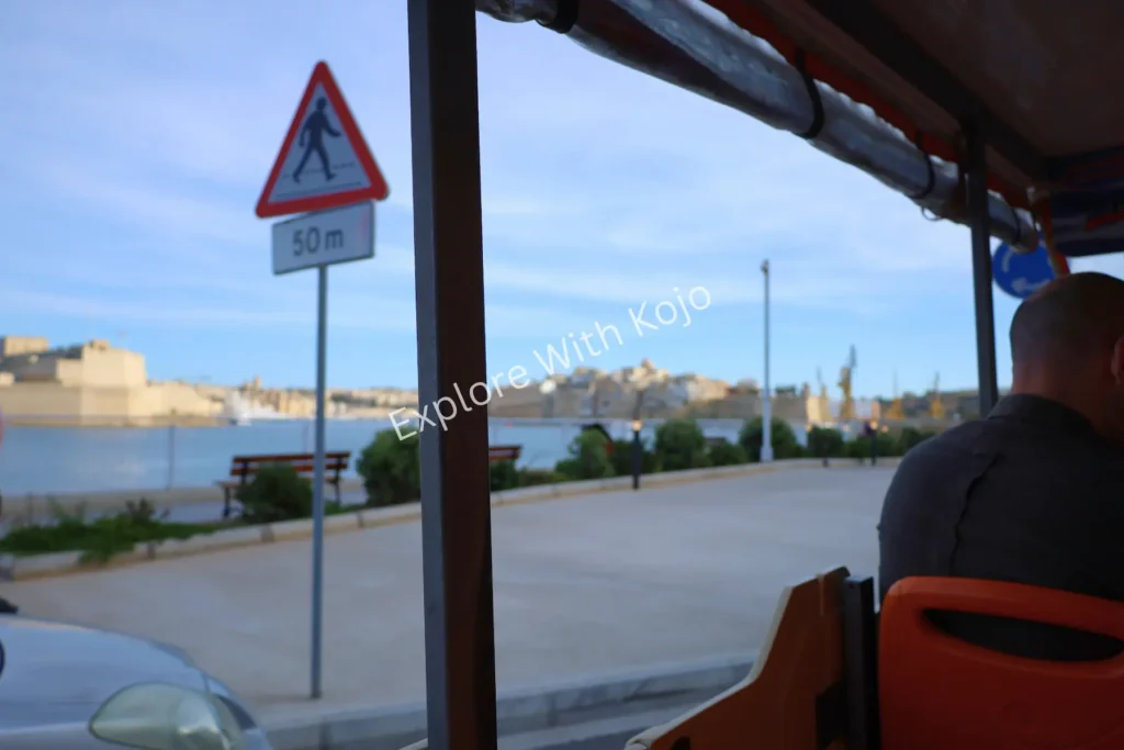 Malta street sign from tour bus.
