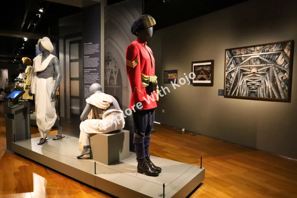 Exhibit showing mannequins dressed in traditional Indian clothing at the Indian Heritage Centre in Singapore.