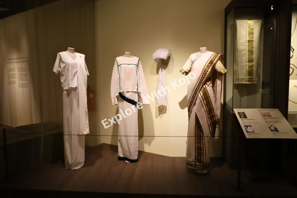 Display of traditional Indian white attire and headgear at the Indian Heritage Centre in Singapore