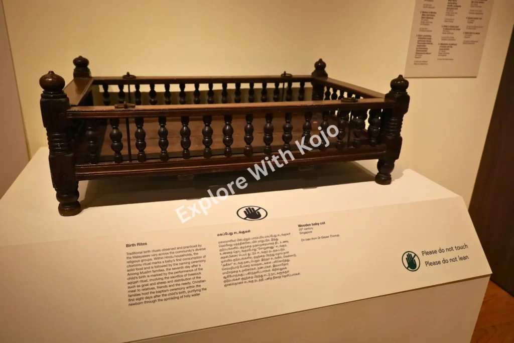 Wooden cradle on display at the Indian Heritage Centre in Singapore