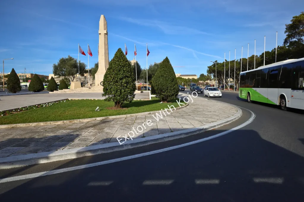 Malta War Memorial at roundabout&nbsp;with&nbsp;buses.