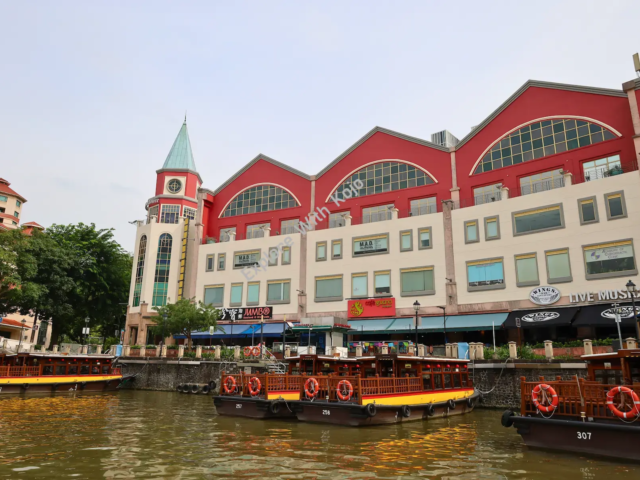 Clarke Quay in Singapore with boats and colonial-style buildings