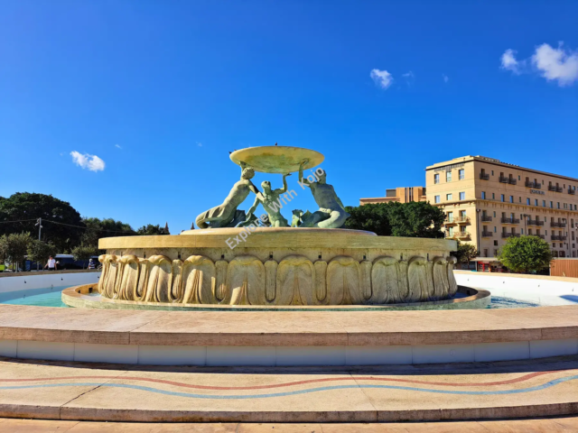 Triton Fountain in Valletta, Malta with a clear sky
