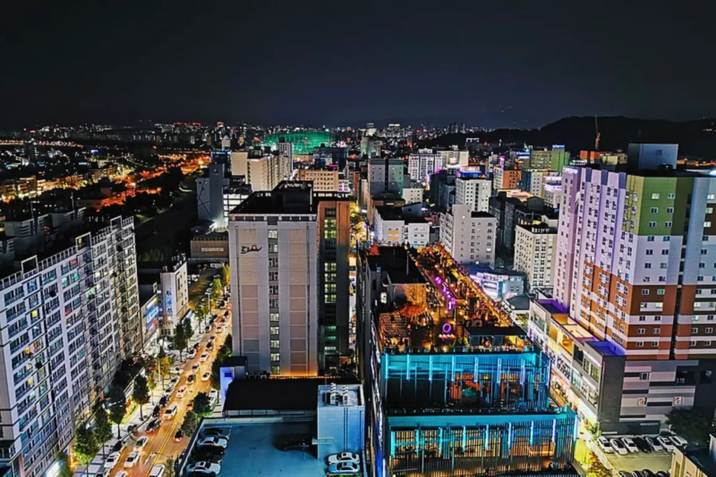 Night cityscape of Daejeon with glowing lights.