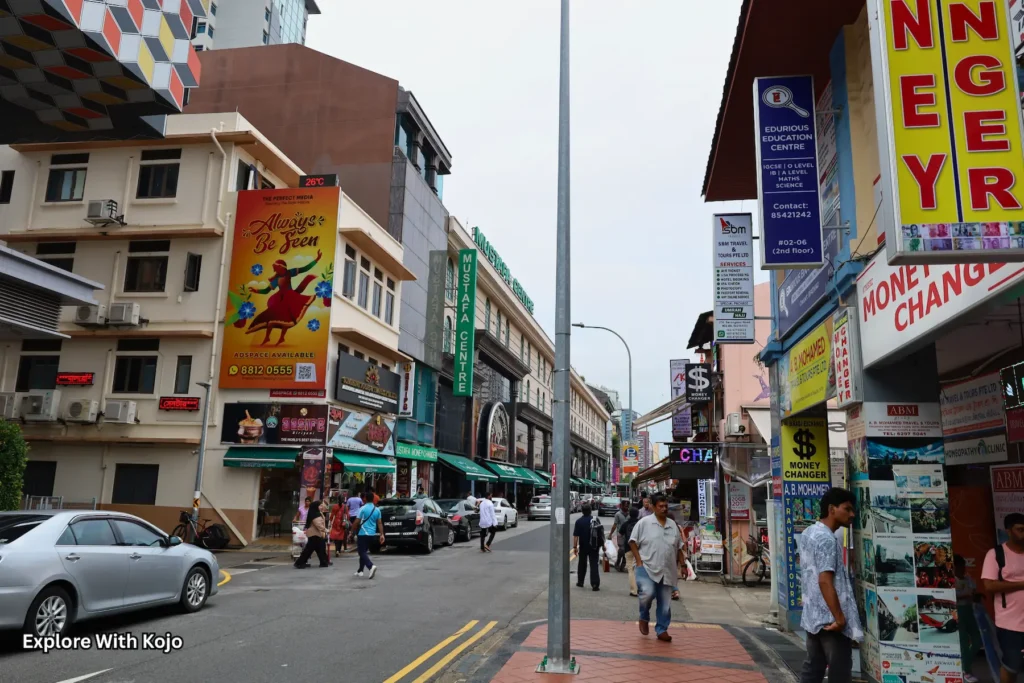 Busy street in Little India, Singapore with colorful shops and signs