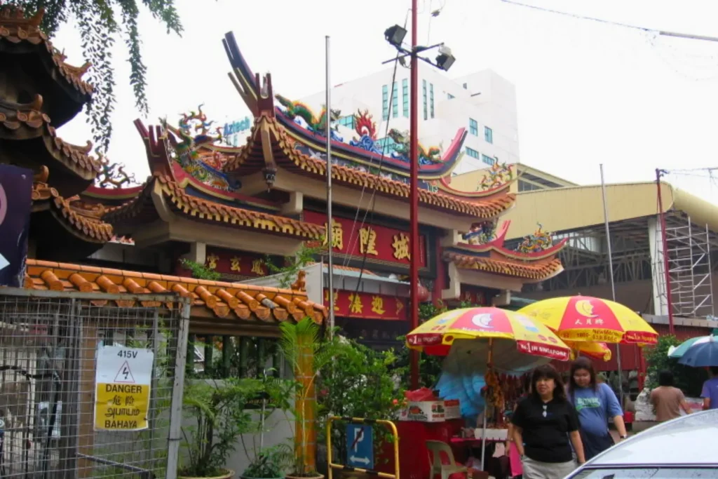 Geylang street with temple and food stalls in Singapore