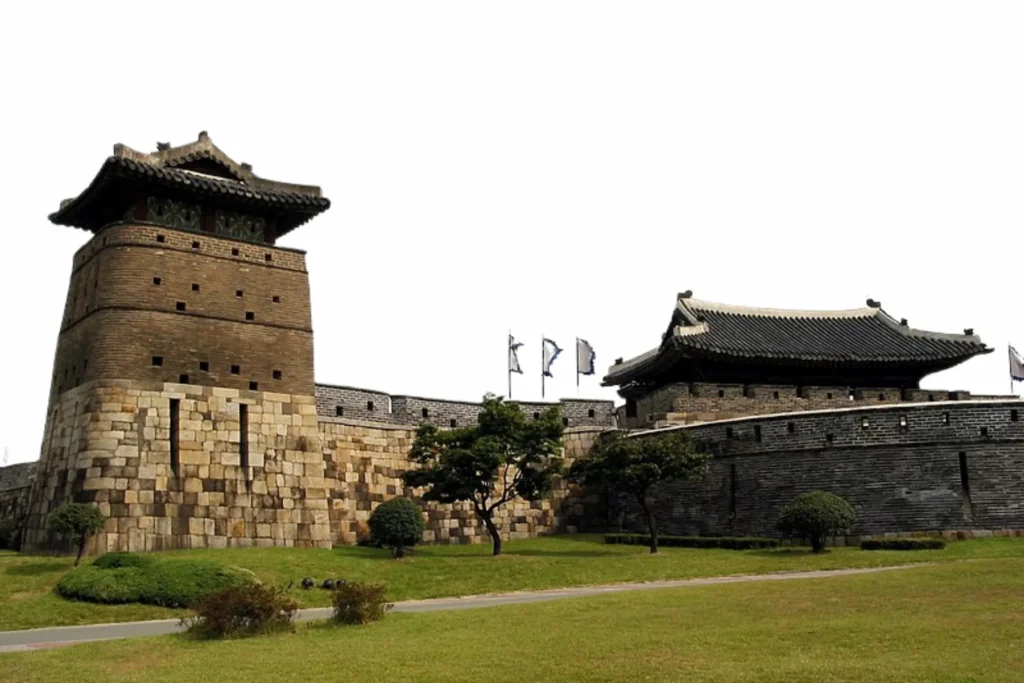 Hwaseong Fortress in Suwon under a clear sky.