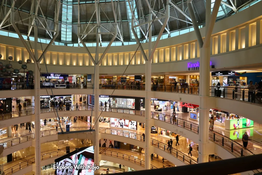 Busy weekend crowds inside Suria KLCC Mall.