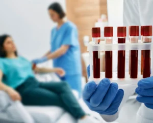 Blood samples being collected during a visa medical test, representing the process at Al Karama Medical Center in Dubai.