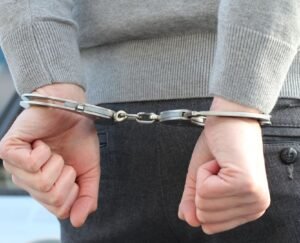 Thai police officers arrest a British tourist in Bangkok hotel drug bust over crystal meth hidden in tea bags