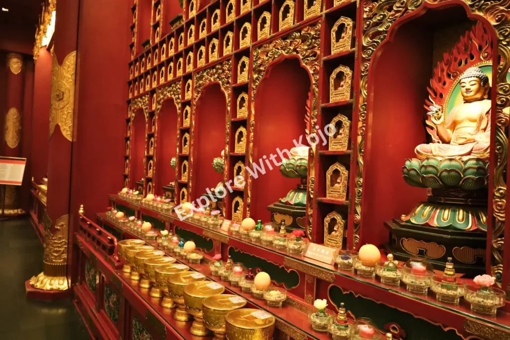 Golden statues displayed in niches along the temple walls.