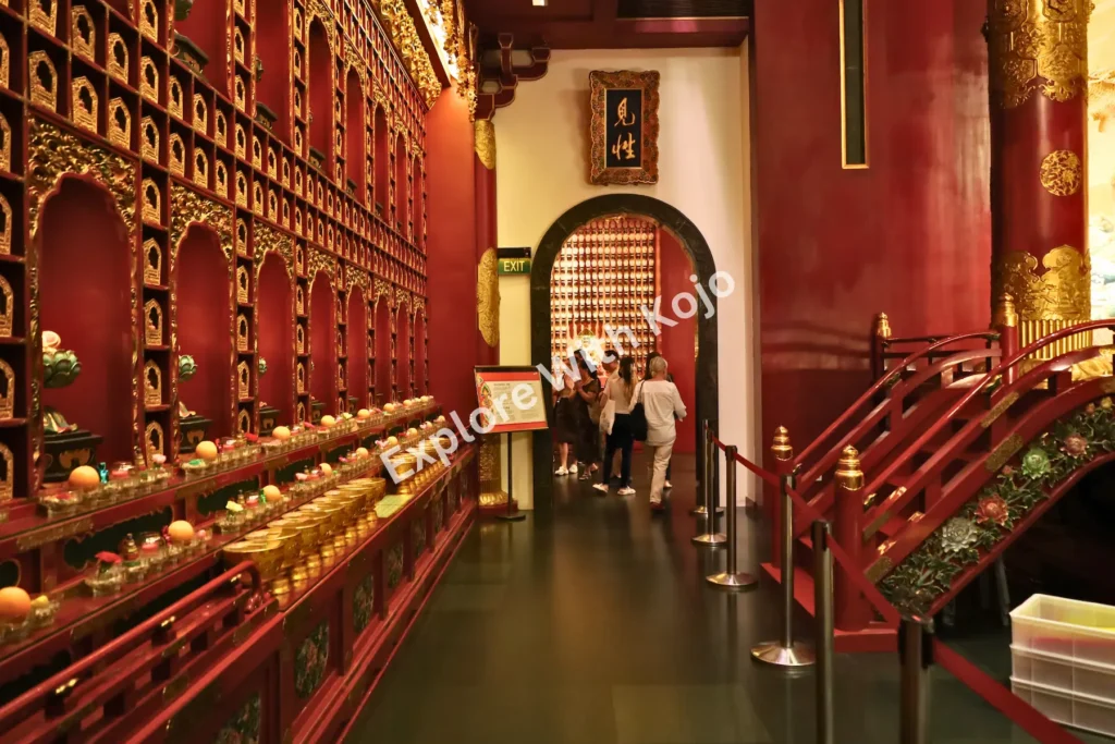 Interior corridor with rows of golden niches inside Buddha Tooth Relic Temple.