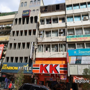 Street view of Bukit Bintang Kuala Lumpur with many signs and shops