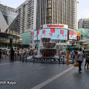 Busy Pavilion KL street scene with pedestrians in Kuala Lumpur