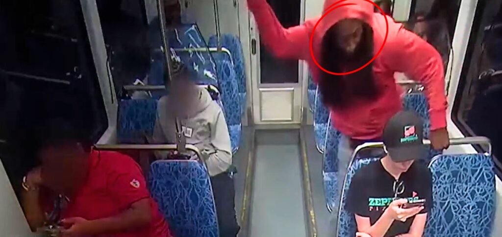 Surveillance footage showing Decarlos Brown Jr. in a red hoodie attacking Ukrainian refugee Iryna Zarutska on a Charlotte light rail train.