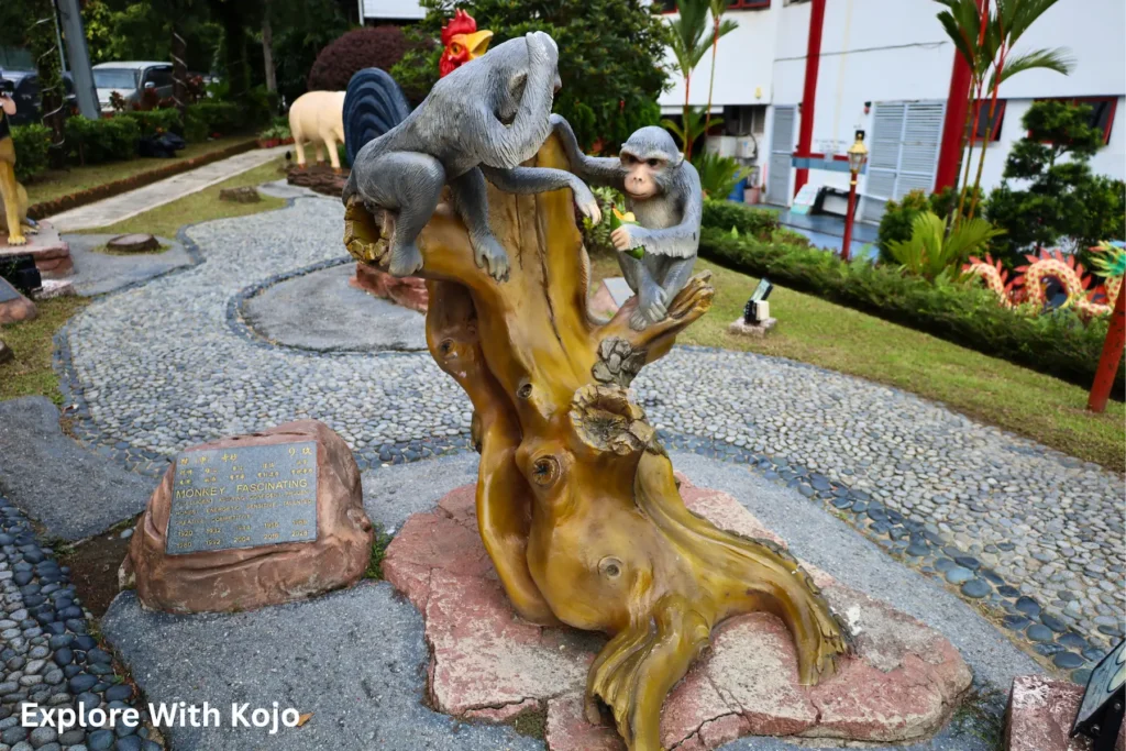 Monkey zodiac statue at Thean Hou Temple in Kuala Lumpur, symbolizing intelligence and playfulness.