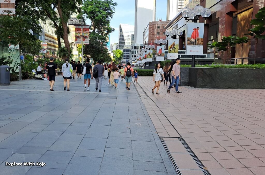 Tourists walking along Orchard Road in Singapore, a safe and popular travel destination