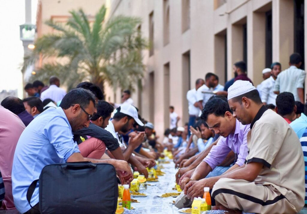 Muslims in Dubai sharing a communal iftar meal during Ramadan.