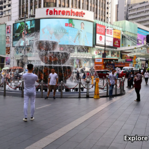 Evening street crowds outside Fahrenheit88 Mall in Bukit Bintang