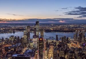 New York City skyline at sunset representing America’s beauty and contrast, used as a featured image for an article on U.S. safety for travelers and expats.