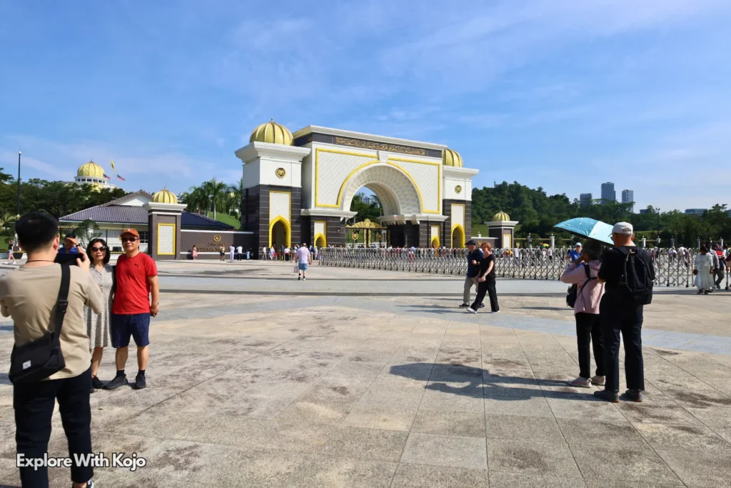 Tourists visiting the main gate of Istana Negara, the King’s Palace in Kuala Lumpur, Malaysia