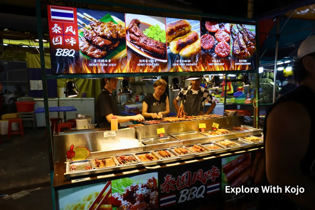 Jalan Alor stall selling grilled meats and skewers at night