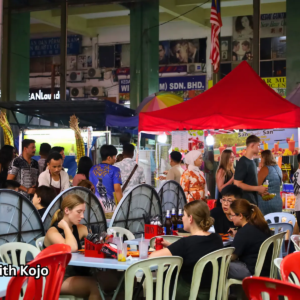 Jalan Alor&rsquo;s crowded food court with red tents and food stalls Jalan Alor Busy Food Court at Night