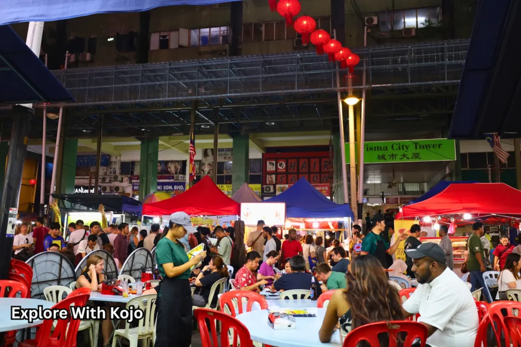 Crowds dining at Jalan Alor’s outdoor food stalls in Kuala Lumpur