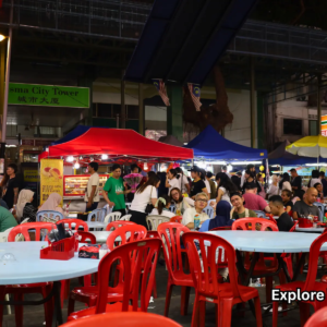 Visitors dining at Jalan Alor Night Market outdoor seating area