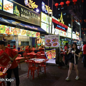 Diners enjoying outdoor meals at Jalan Alor Night Market