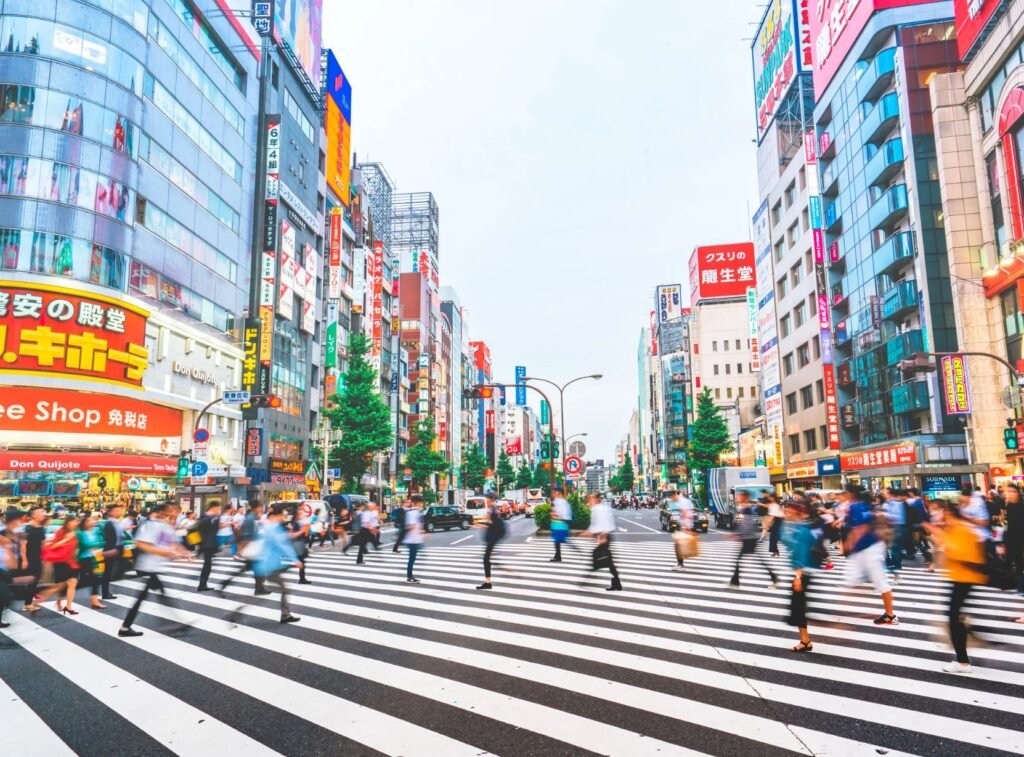 Busy Tokyo street crossing with people walking. 