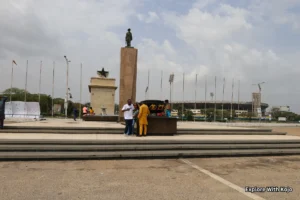 Ghana’s Independence Square in Accra with people gathered near the monument and Black Star Gate.