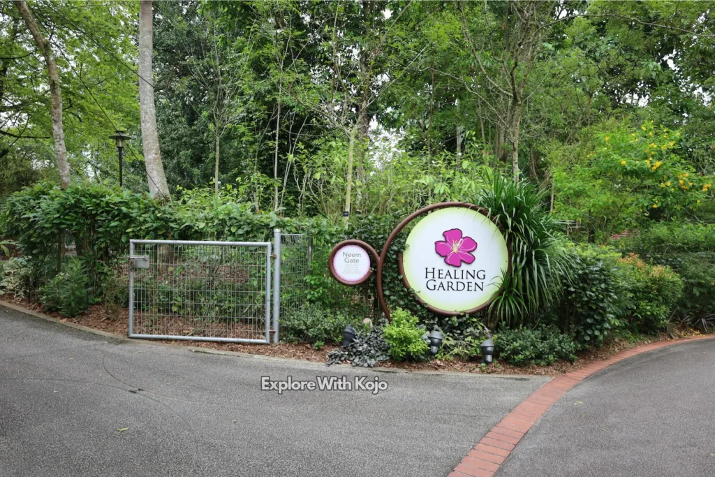 The Healing Garden at the Singapore Botanic Gardens with the main signage visible.