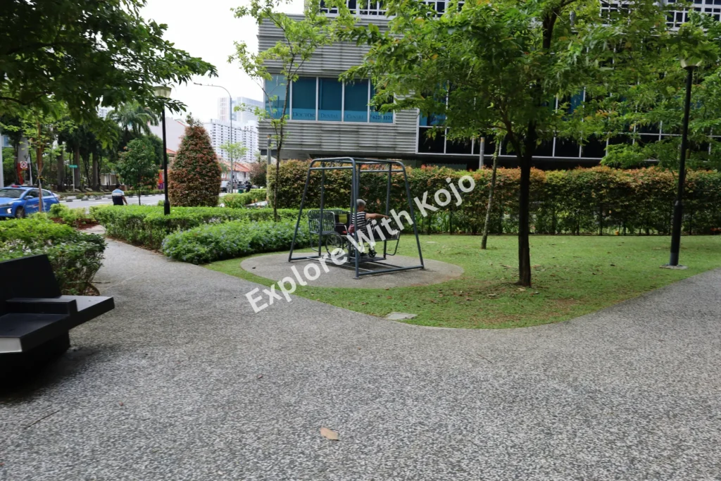 A quiet walking path surrounded by greenery in Singapore.