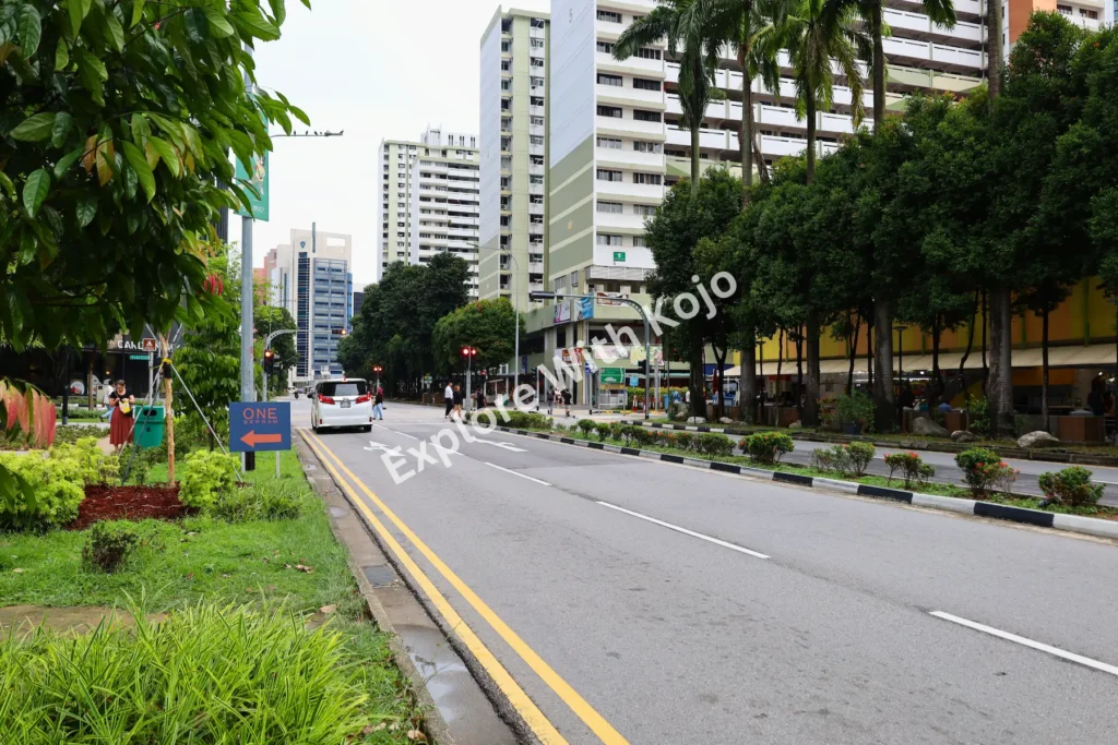 Wide empty street with apartments in Singapore.