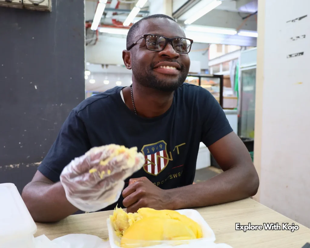 Kojo enjoying durian in Singapore