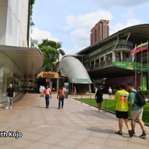 Pedestrians walking near Pavilion in Bukit Bintang, Kuala Lumpur