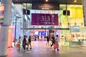 Entrance of 313 Somerset mall on Orchard Road Singapore at night.