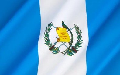 Flag of Guatemala with blue and white stripes and national coat of arms.