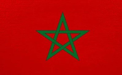 Flag of Morocco with red field and green pentagram star.