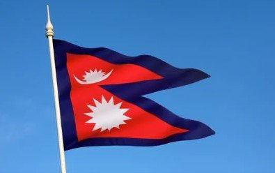 Flag of Nepal with two red triangular pennons bordered in blue with moon and sun symbols.