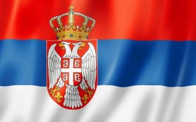 Flag of Serbia with red, blue, and white horizontal stripes and national coat of arms.