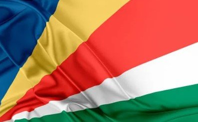 Flag of Seychelles with diagonal bands of blue, yellow, red, white, and green.