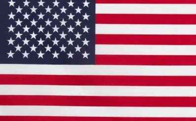 Flag of the United States with red and white stripes and blue canton with white stars.