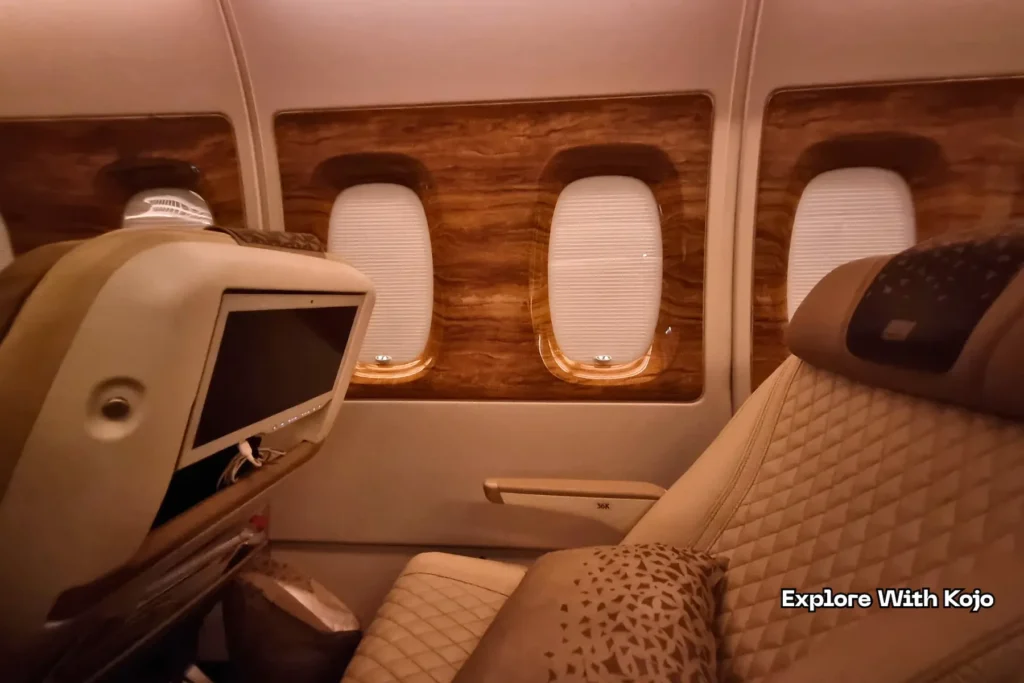 Interior of a premium airplane cabin with seats and window view