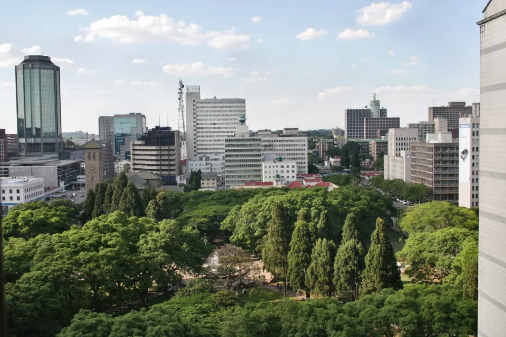 City park with modern buildings in Minsk, Belarus.