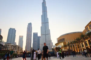 Tourists at Burj Khalifa in Downtown Dubai during sunset