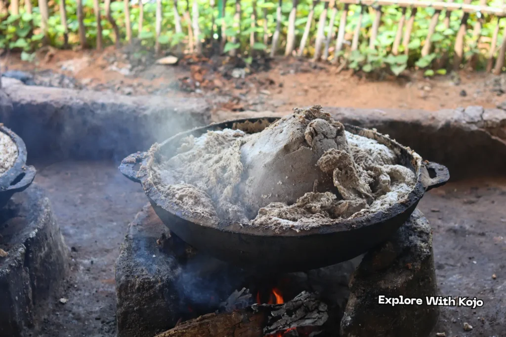 African black soap cooking on fire during traditional production in Tamale, Ghana