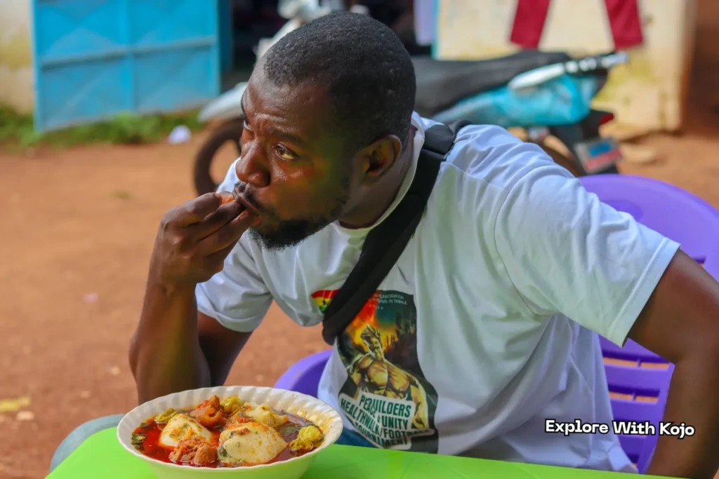 Close up view of Ghanaian tuo zaafi with meat in spicy soup.