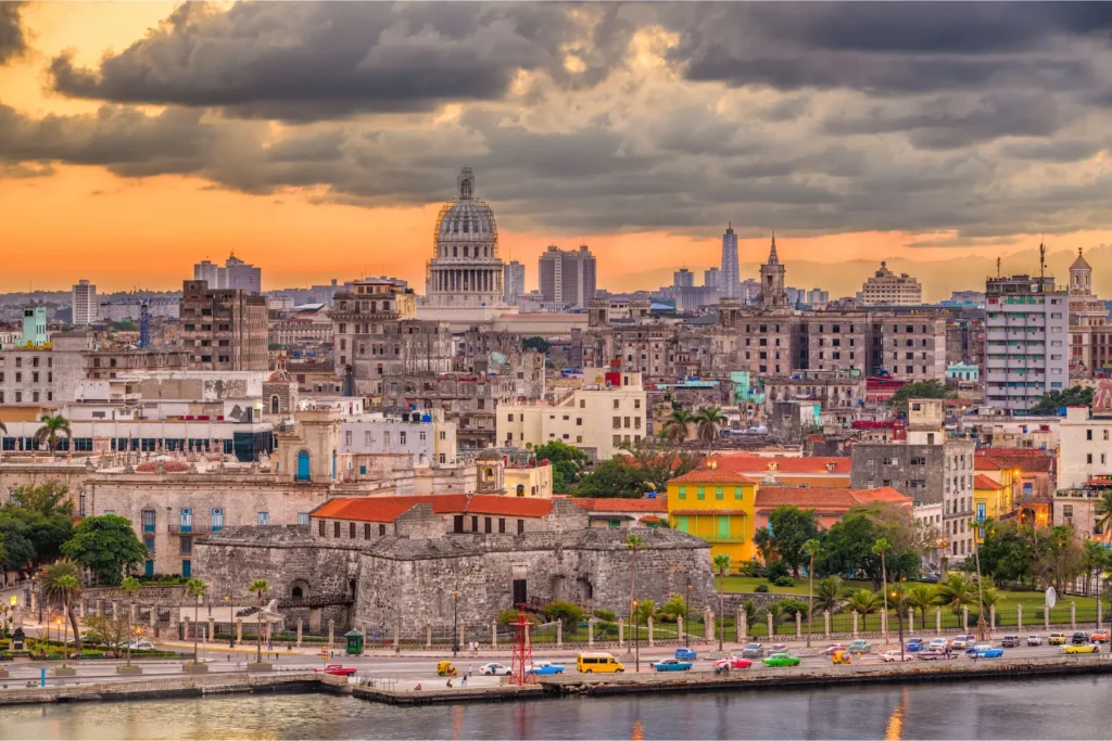 Havana city skyline at sunset with colorful colonial buildings in Cuba.